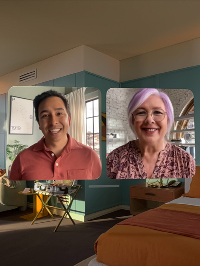 Two people in life-size FaceTime video tiles in Apple Vision Pro